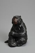 A 20TH CENTURY JAPANESE BRONZE OKIMONO OF A MONKEY BY HIDEYAMA. Naturalistically modelled seated,