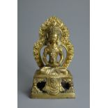 A CHINESE GILT BRONZE FIGURE OF AMITAYUS, QIANLONG PERIOD (1736-1795). The Buddha seated on an