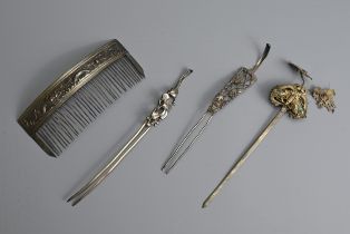 A GROUP OF CHINESE METAL WARE HAIR PINS, EARLY 20TH CENTURY. Two double pronged pins with pierced
