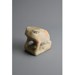 A CHINESE WHITE MABLE MODEL OF A FROG, TANG DYNASTY OR LATER. Seated on a rectangular base with