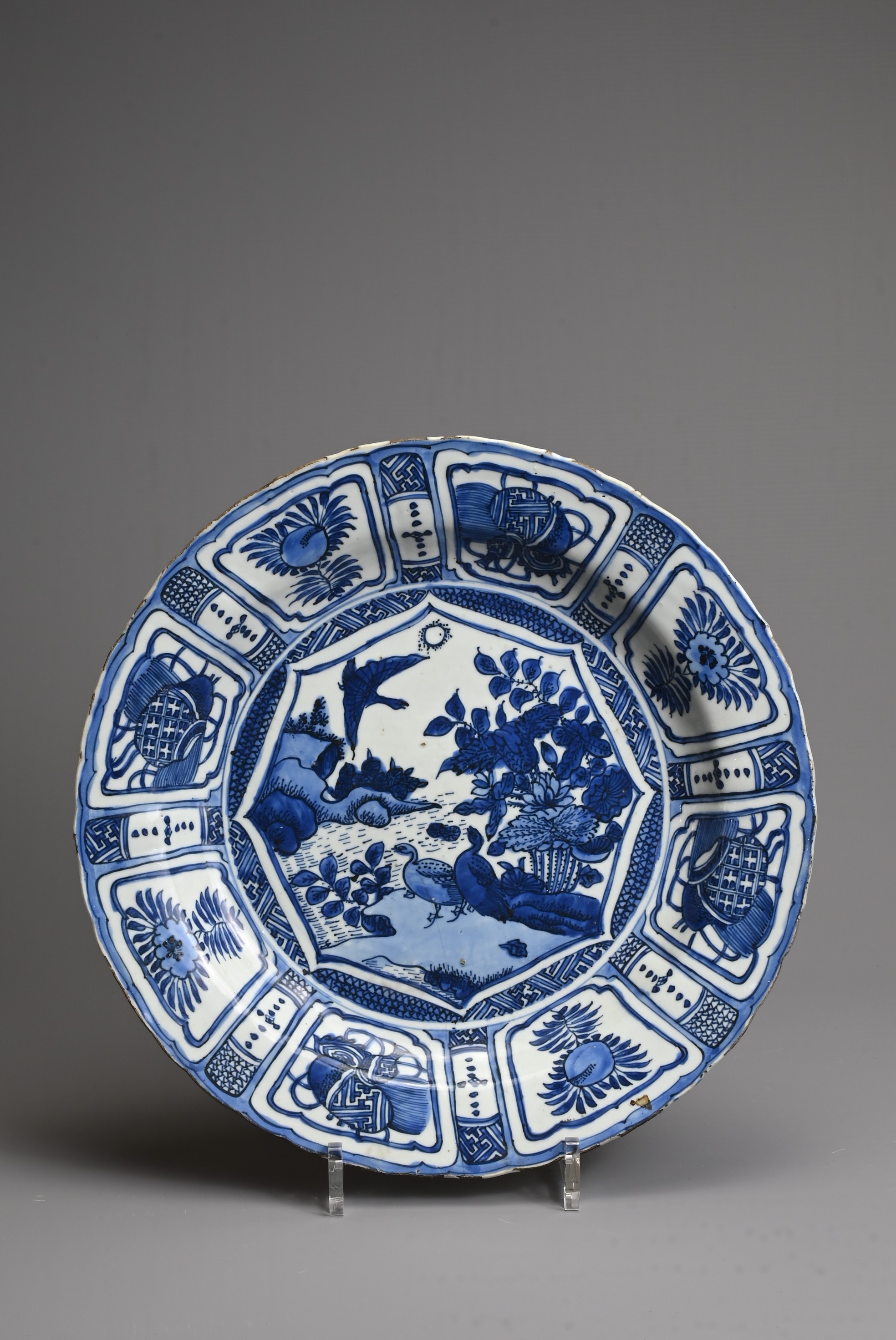 A CHINESE BLUE AND WHITE PORCELAIN KRAAK DISH, MING DYNASTY. Decorated with ducks at a lotus pond