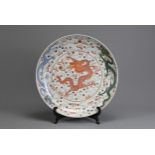 A LARGE CHINESE FAMILLE ROSE PORCELAIN DRAGON DISH, 19/20TH CENTURY. With deep rounded sides