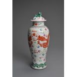 A CHINESE FAMILLE ROSE PORCELAIN VASE AND COVER, EARLY 20TH CENTURY. Of baluster form decorated with