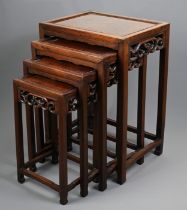 A NEST OF FOUR CHINESE ROSEWOOD AND BURR WALNUT TABLES, EARLY 20TH CENTURY. Of rectangular form with