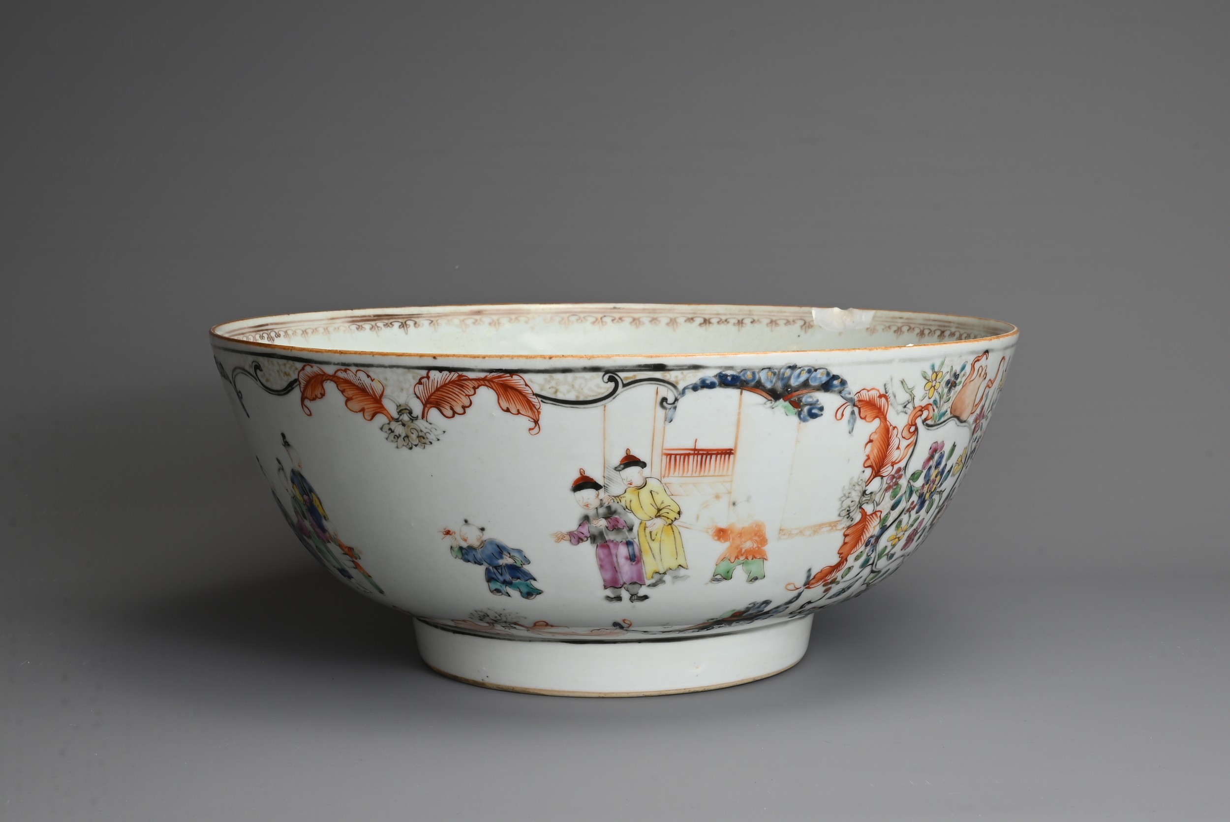 A CHINESE FAMILLE ROSE PORCELAIN PUNCH BOWL, 18TH CENTURY. Decorated with figures in a courtyard - Image 3 of 6