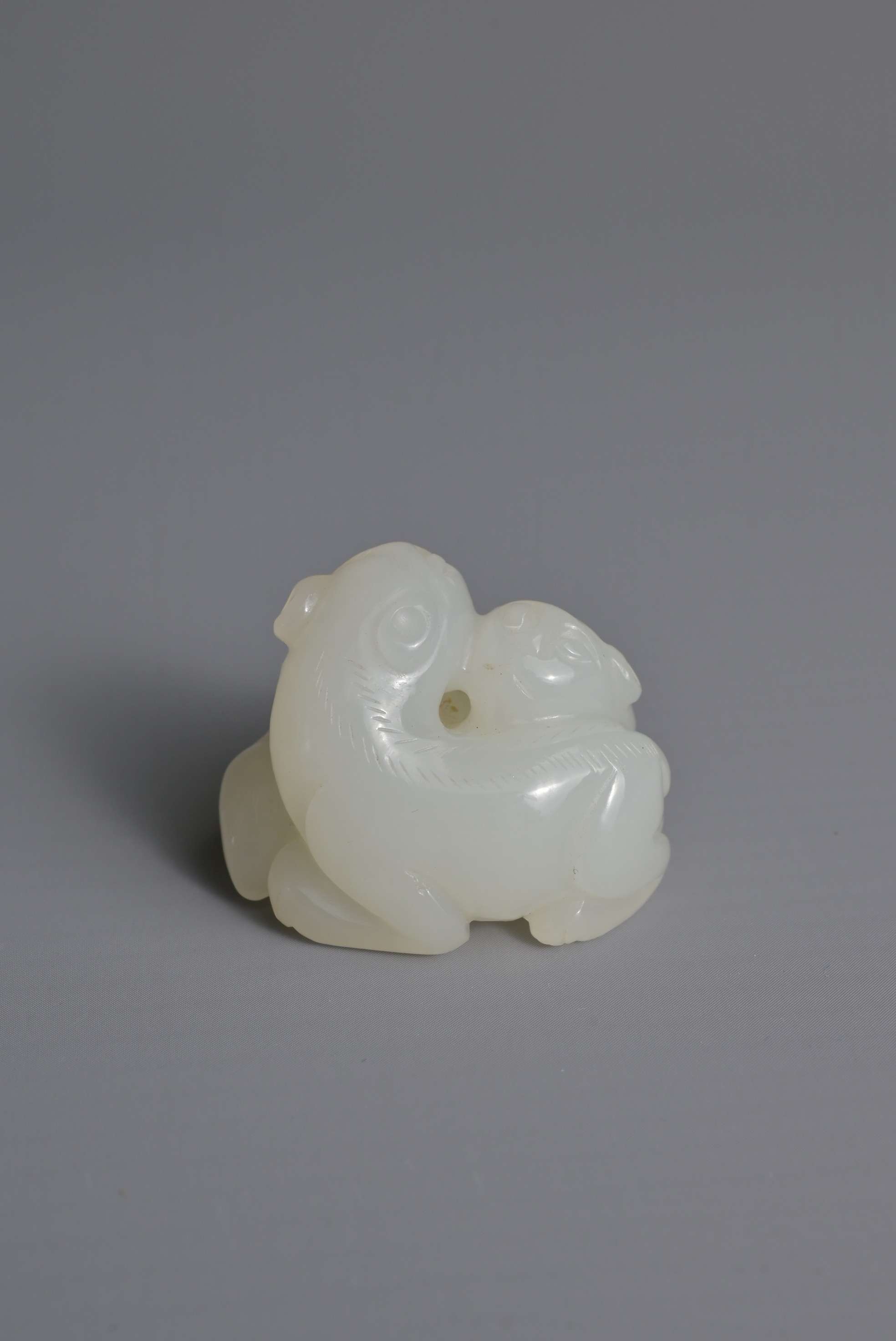 A CHINESE WHITE JADE LION GROUP PENDANT, QING DYNASTY. Carved in the form with two recumbent lions - Image 6 of 8