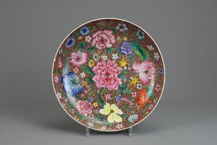 A CHINESE MILLEFLEUR DECORATED DISH, EARLY 20TH CENTURY. With rounded sides decorated to the