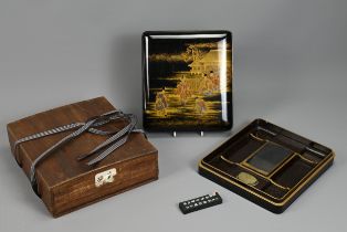 A 19TH CENTURY JAPANESE LACQUER WRITING BOX (SUZURIBAKO). The exterior of the lid decorated in gold,