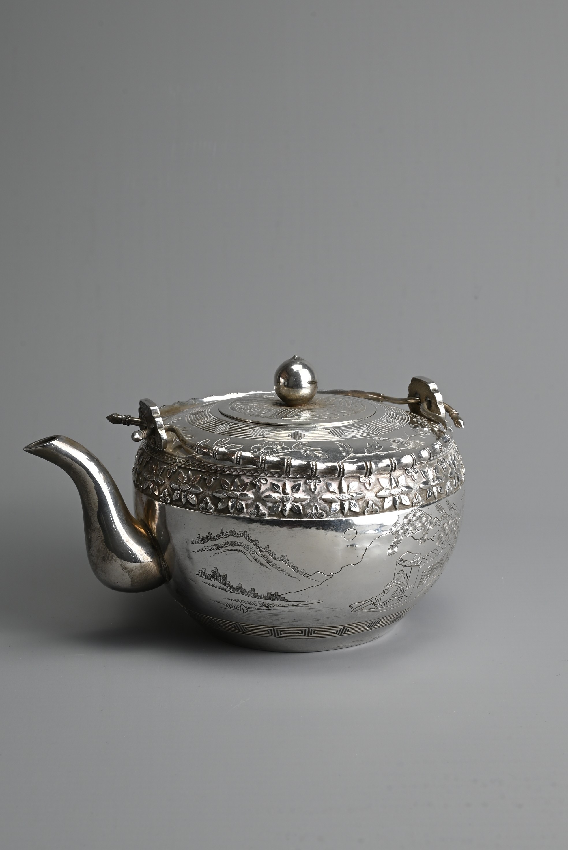 A FINE CHINESE SILVER TEAPOT, NANKING BAO QING, CIRCA 1900. Of globular form with two faux bamboo