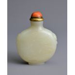 A CHINESE PALE CELADON JADE SNUFF BOTTLE, 19/20TH CENTURY. Of flattened globular form carved in