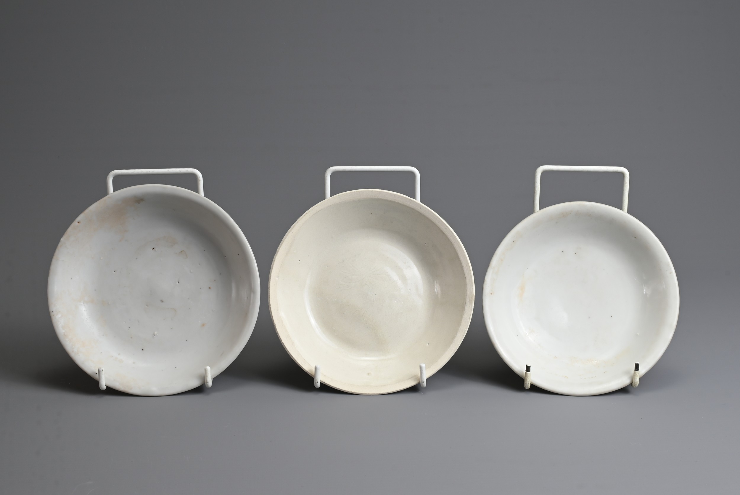 THREE CHINESE PORCELAIN DISHES, SONG AND MING DYNASTY. To include two Blanc de Chine dishes with