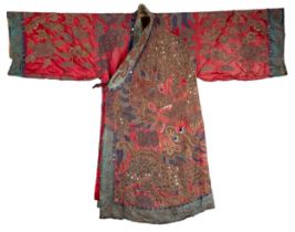 A 20TH CENTURY CHINESE EMBROIDERED COLOURED SILK AND GOLD THREAD DRAGON ROBE. Decorated with large