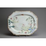 A LARGE CHINESE FAMILLE ROSE OCTAGONAL LOBED PLATTER, 18TH CENTURY. Decorated with boy seated on a