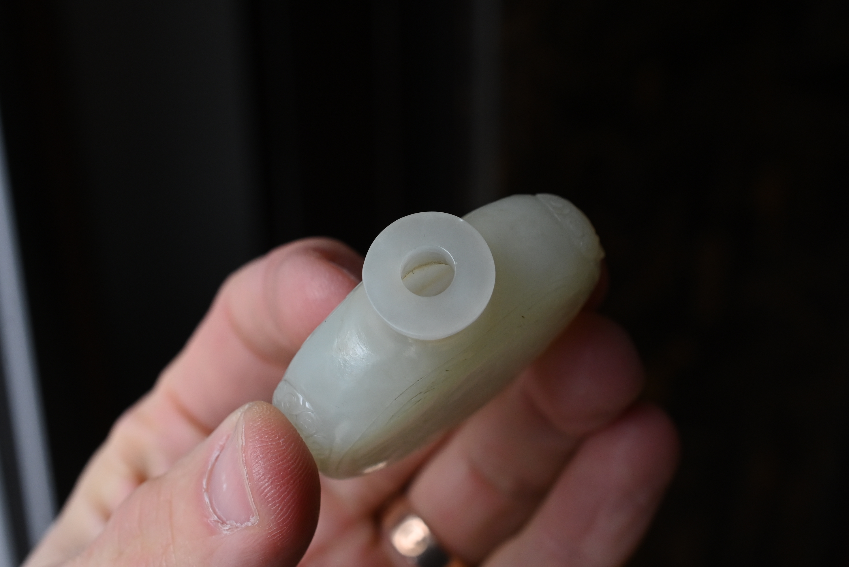 A CHINESE PALE CELADON JADE SNUFF BOTTLE, 19/20TH CENTURY. Of flattened globular form carved in - Image 17 of 27