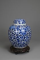 A CHINESE BLUE AND WHITE PORCELAIN JAR AND COVER, LATE 19TH. Decorated with continuous lotus scrolls