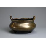 A RARE CHINESE BRONZE TRIPOD CENSER, XUANDE TANG ZHI, 18TH CENTURY. Heavily cast circular body