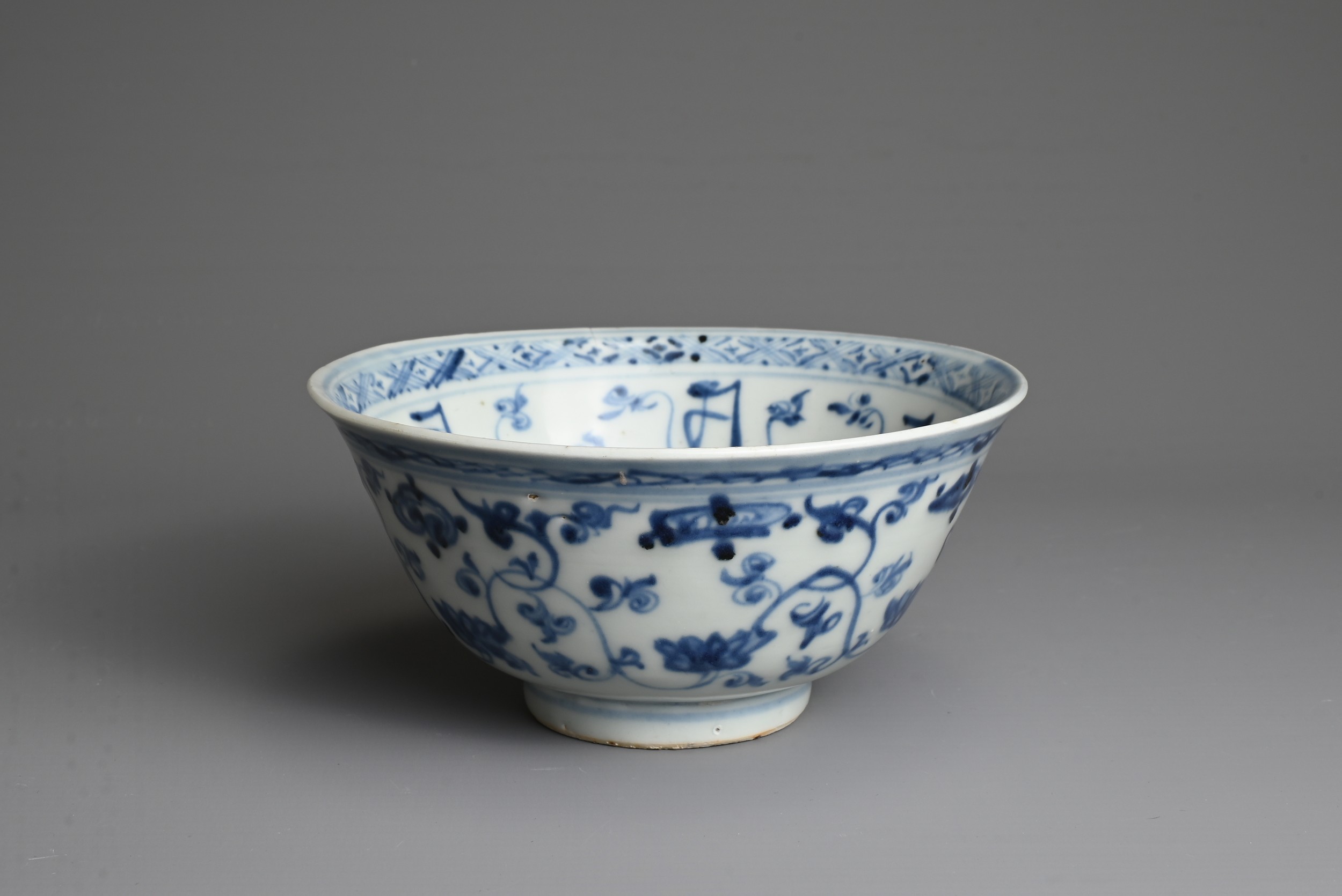 A CHINESE BLUE AND WHITE PORCELAIN BOWL, MING DYNASTY. Decorated with lotus scrolls and Buddhist - Image 2 of 7
