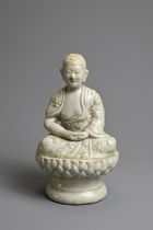 AN UNUSUAL CHINESE PALE CELADON GLAZED PORCELAIN FIGURE OF BUDDHA, 17/18TH CENTURY. Seated on a