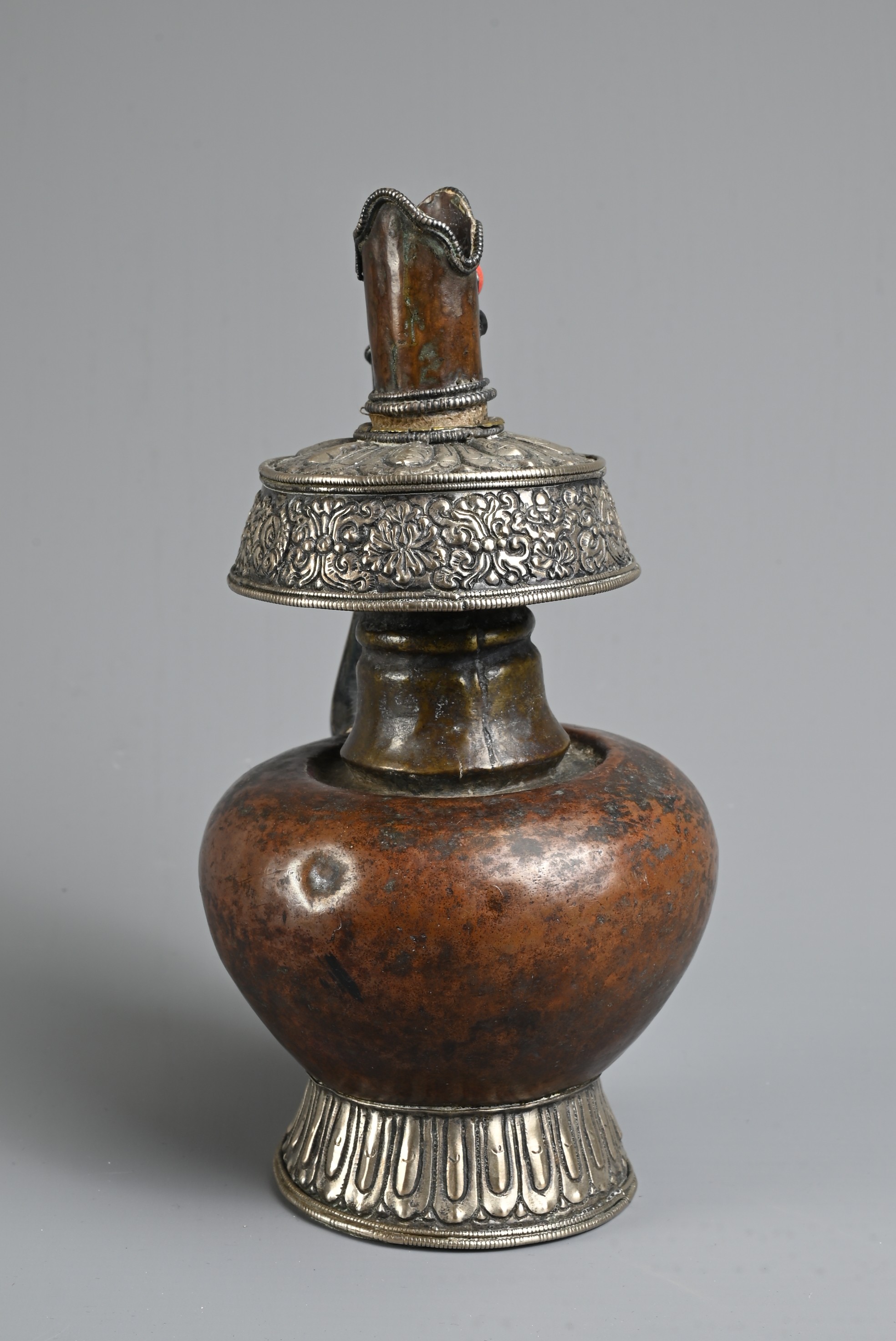 A TIBETAN COPPER AND SILVER EWER, BUMPA, 19/20TH CENTURY. With copper body and splayed silver foot - Image 3 of 7