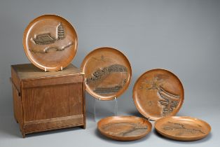 FIVE 20TH CENTURY JAPANESE SENCHA (TEA CEREMONY) CARVED WOODEN CIRCULAR TRAYS. Each carved with a