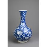 A CHINESE BLUE AND WHITE PORCELAIN PRUNUS BOTTLE VASE, 19TH CENTURY. With globular body and flared