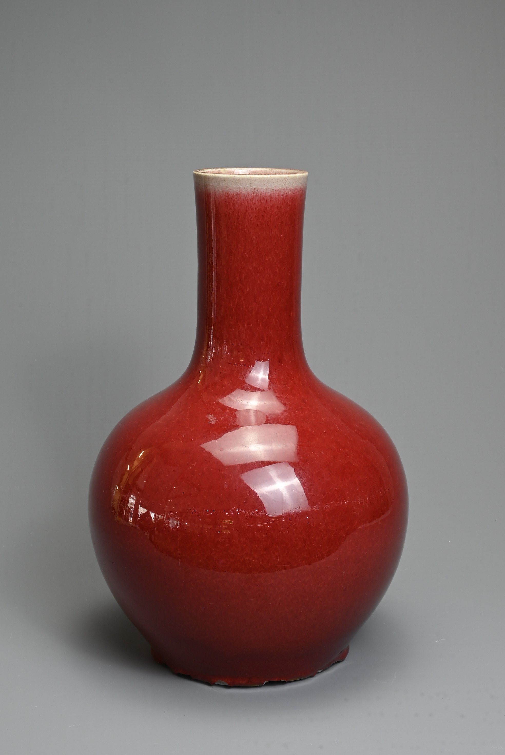 A CHINESE SANG DE BOEUF GLAZED PORCELAIN VASE, 19/20TH CENTURY. Globular bottle with tall - Image 2 of 6