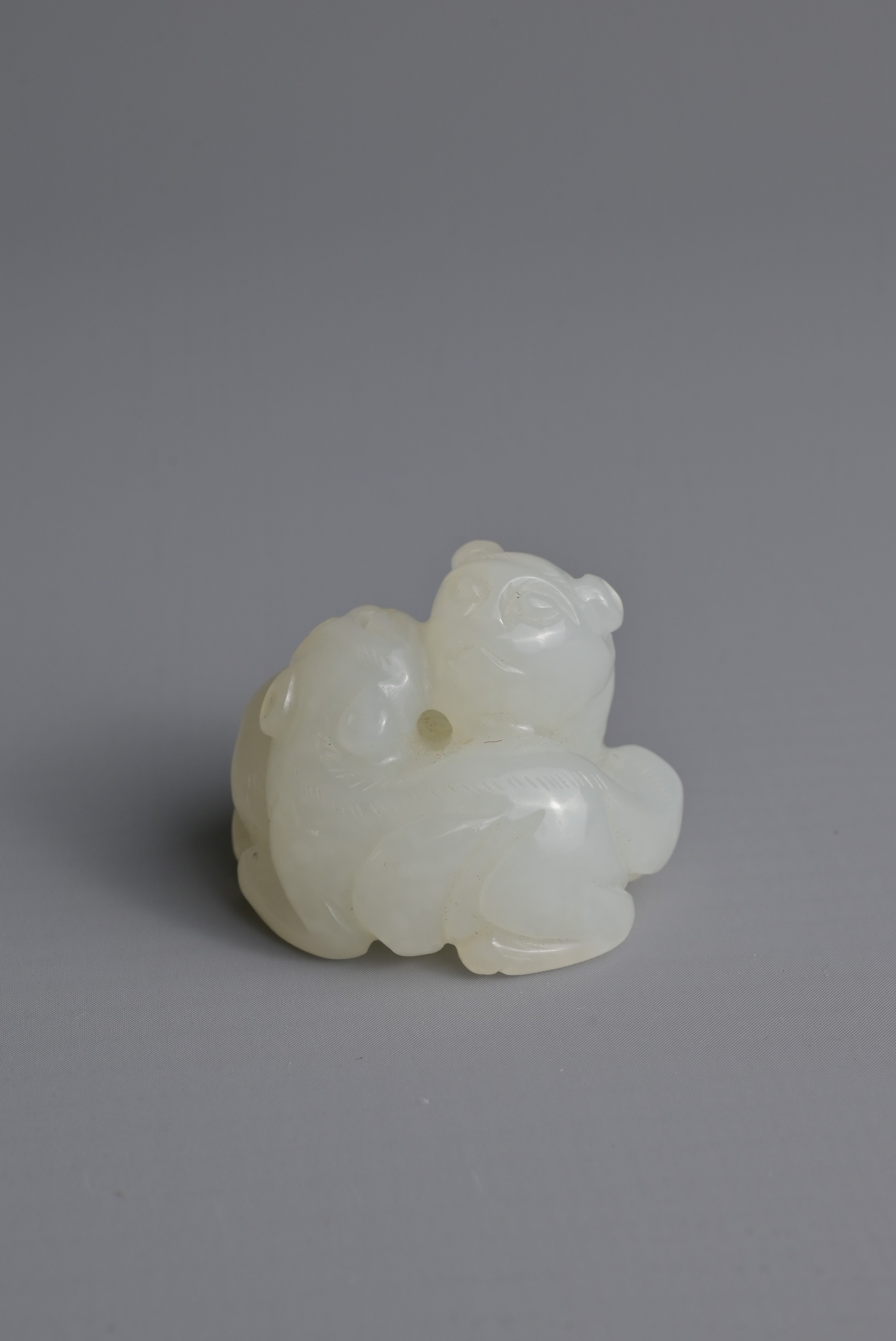 A CHINESE WHITE JADE LION GROUP PENDANT, QING DYNASTY. Carved in the form with two recumbent lions - Image 4 of 8