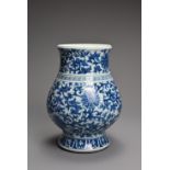 A CHINESE BLUE AND WHITE PORCELAIN HU TYPE JAR, 18/19TH CENTURY. Of wide baluster form decorated