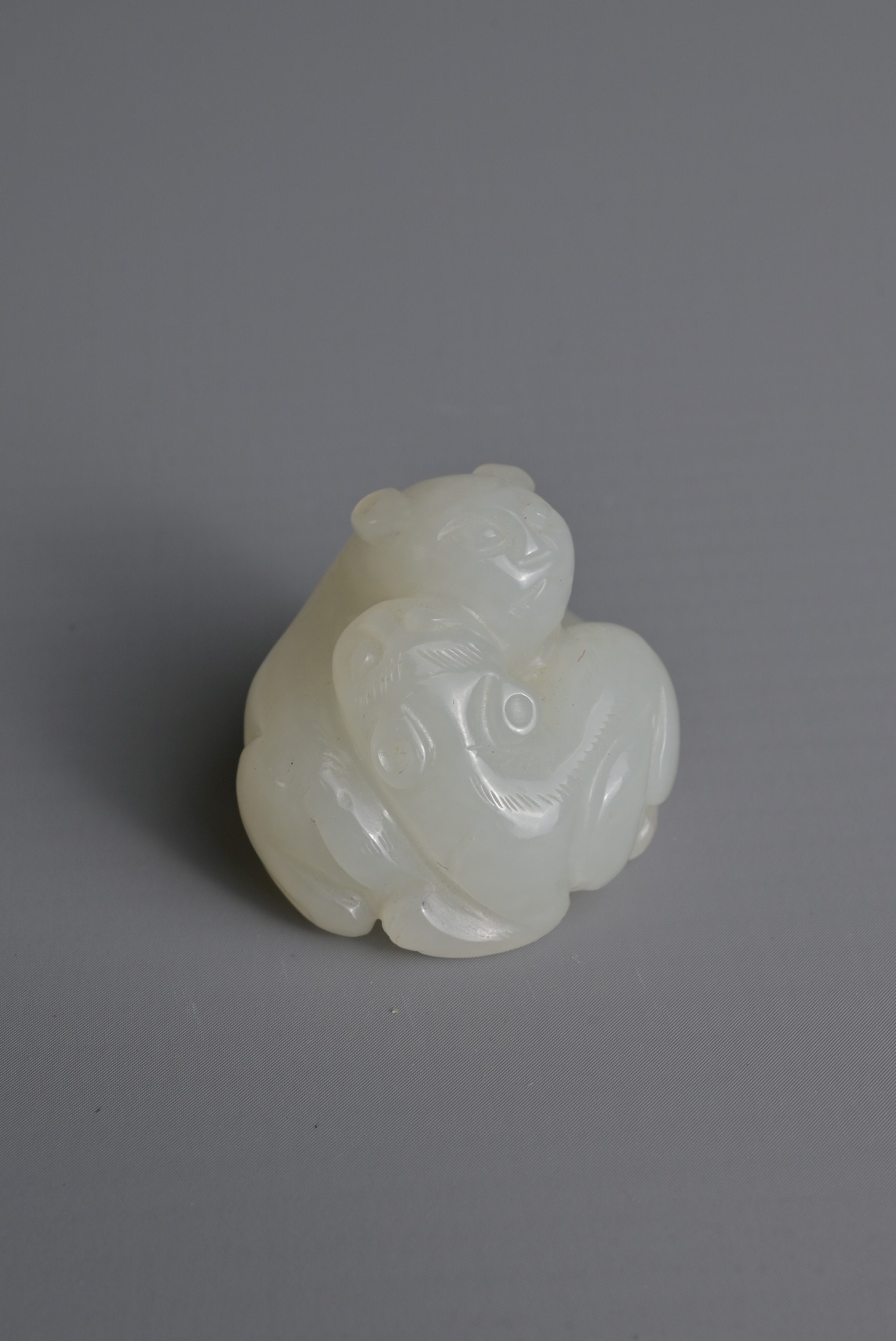 A CHINESE WHITE JADE LION GROUP PENDANT, QING DYNASTY. Carved in the form with two recumbent lions - Image 8 of 8