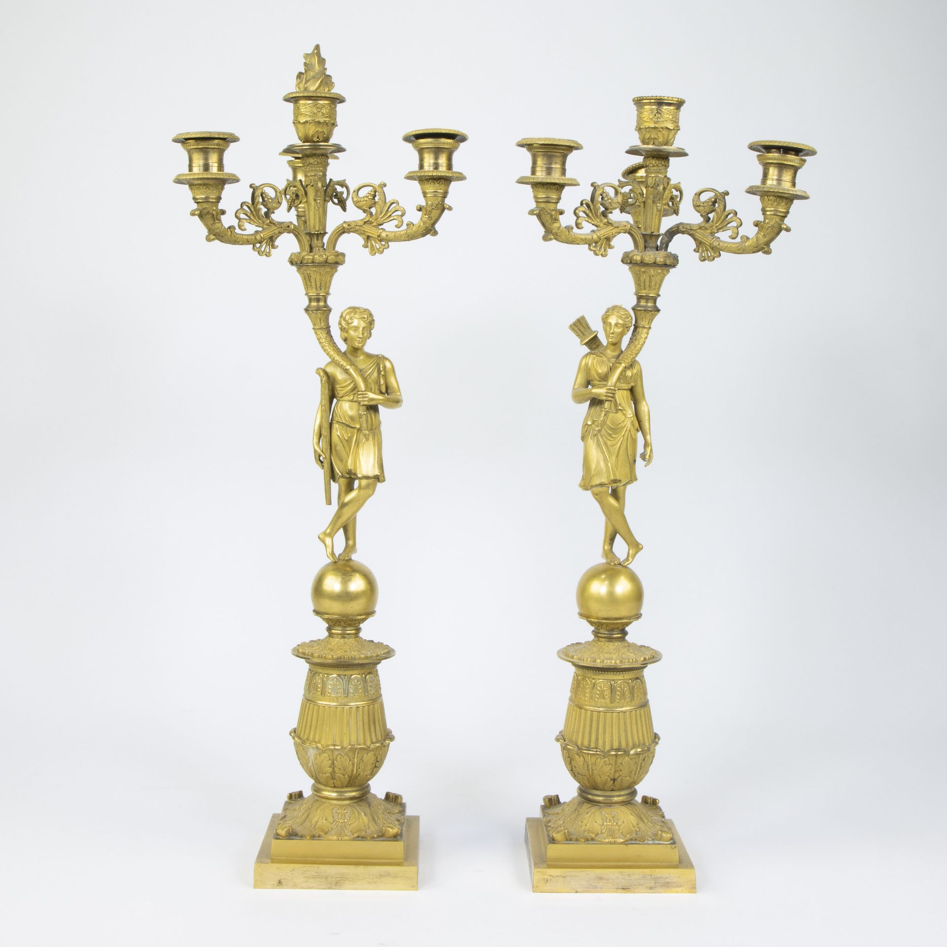 Pair of ormolu Empire candlesticks depicting Diana and Apollo, French, 19th century