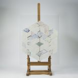 Geometric artwork consisting of individual porcelain plates attached to a plexi plate, monogrammed, 