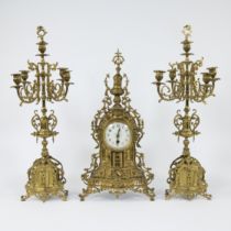 A three-piece garniture set in yellow copper, Napoleon III style, 20th century