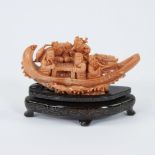 A Chinese group in red coral with figures in a boat, 19/20th century