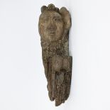 Fragment of wooden sculpture with face, 17th century