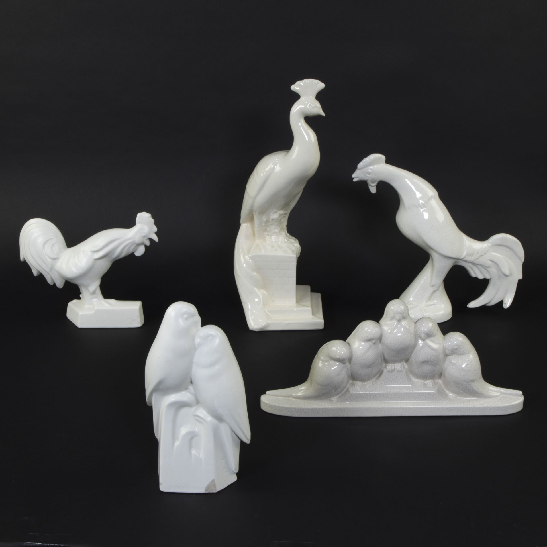 Collection of Art Deco sculptures of crackled ceramics, pair of birds, rooster with chicks, peacock