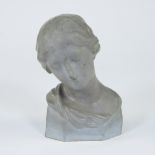 Bust of girl's head in ceramics, monogrammed