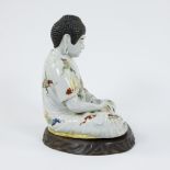 Japanese porcelain statue of a seated Buddha on wooden plinth, circa 1900s