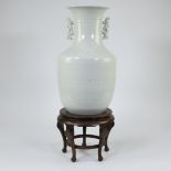 Chinese vase in white porcelain on wooden base