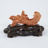 A Chinese group in red coral with an oarsman and boat, 19/20th century
