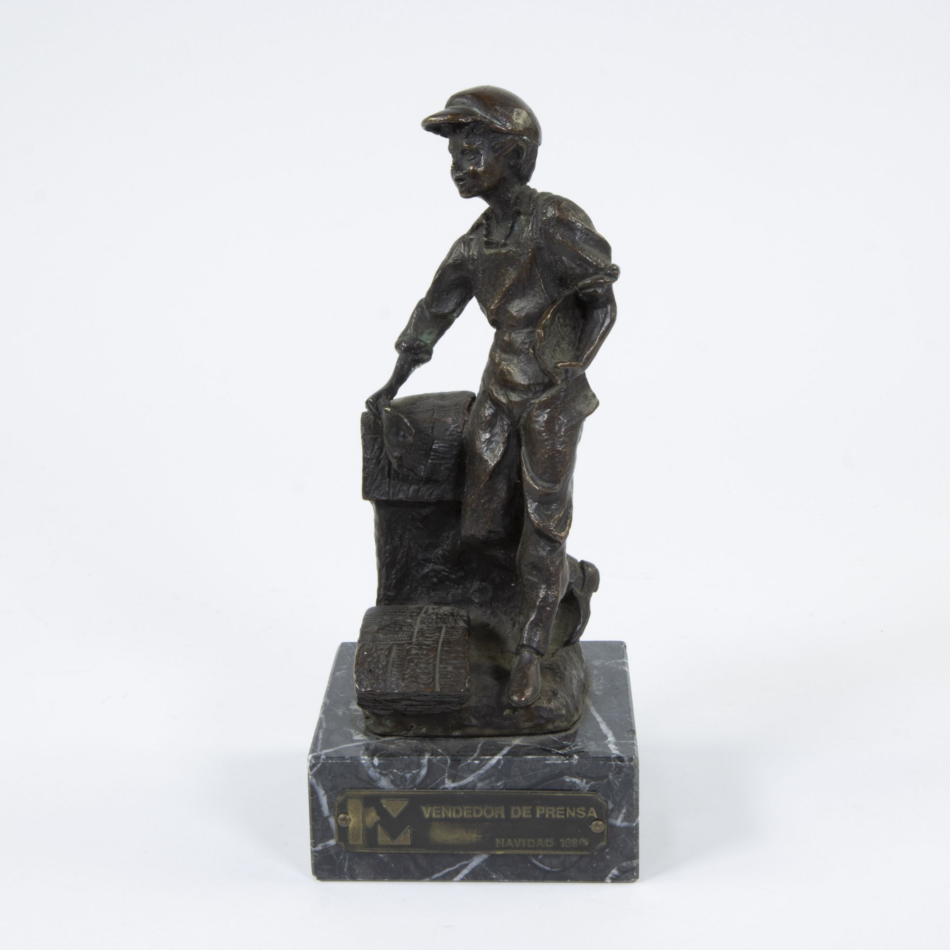 Bronze sculpture of a newspaper vendor, signed José Manuel and numbered 197/400