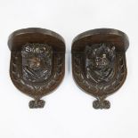 Pair of wooden hanging consoles with boys adorned with a turban