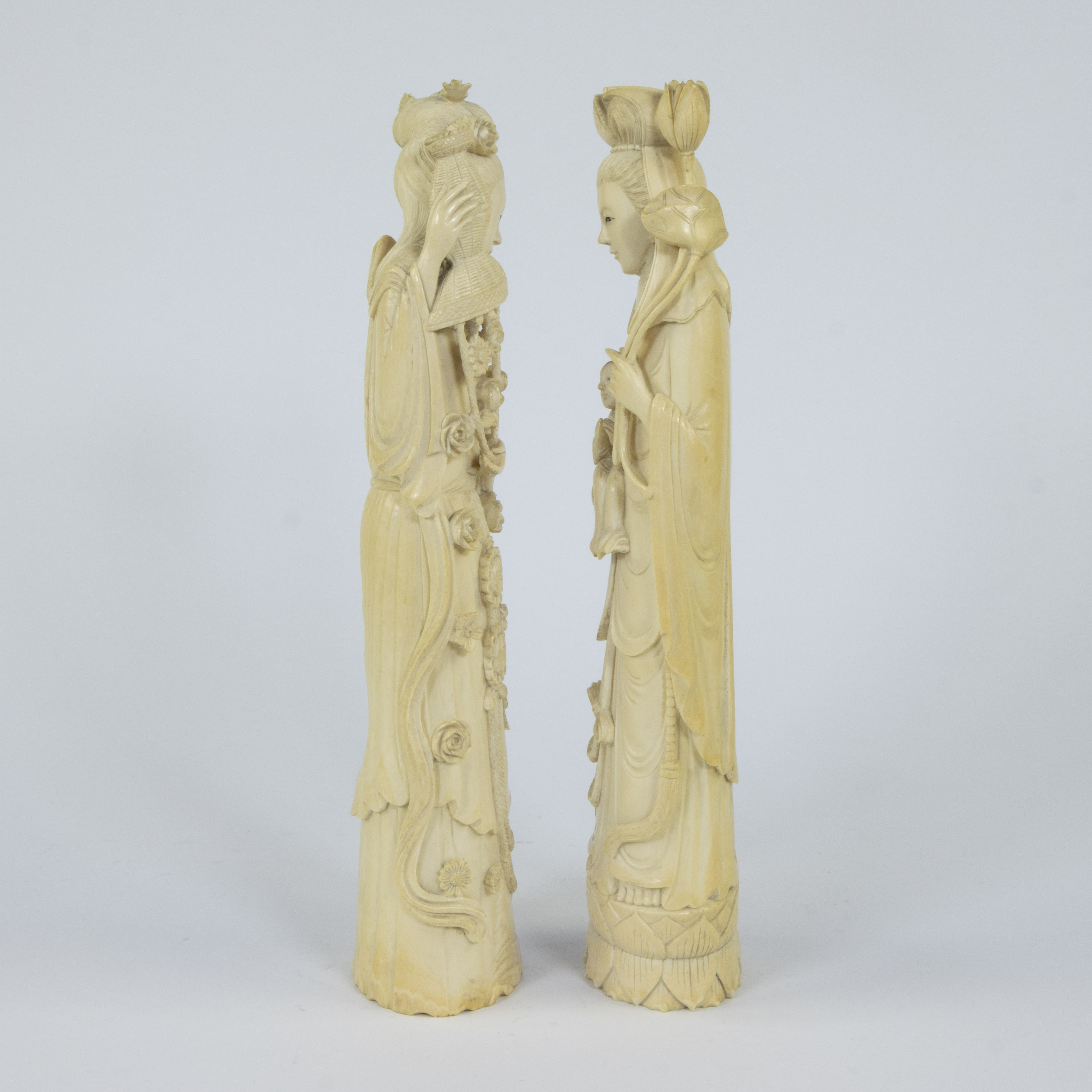 A pair of Japanese ivory sculptures depicting two female goddesses with long robes in a graceful bow - Image 2 of 5