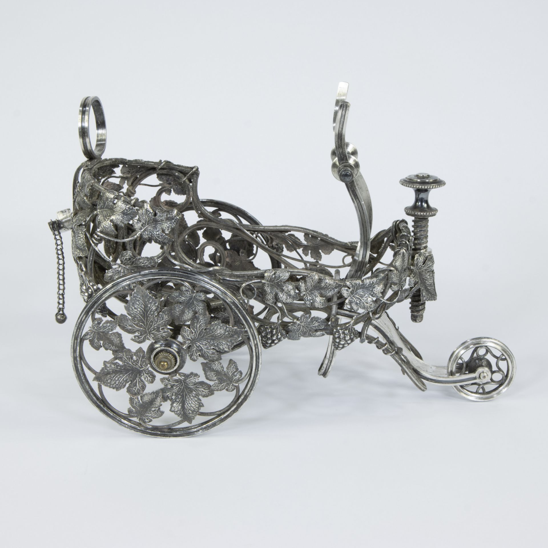 A French large silver-plated bottle chariot on three wheels, decorated with vines and grapes - Image 4 of 6