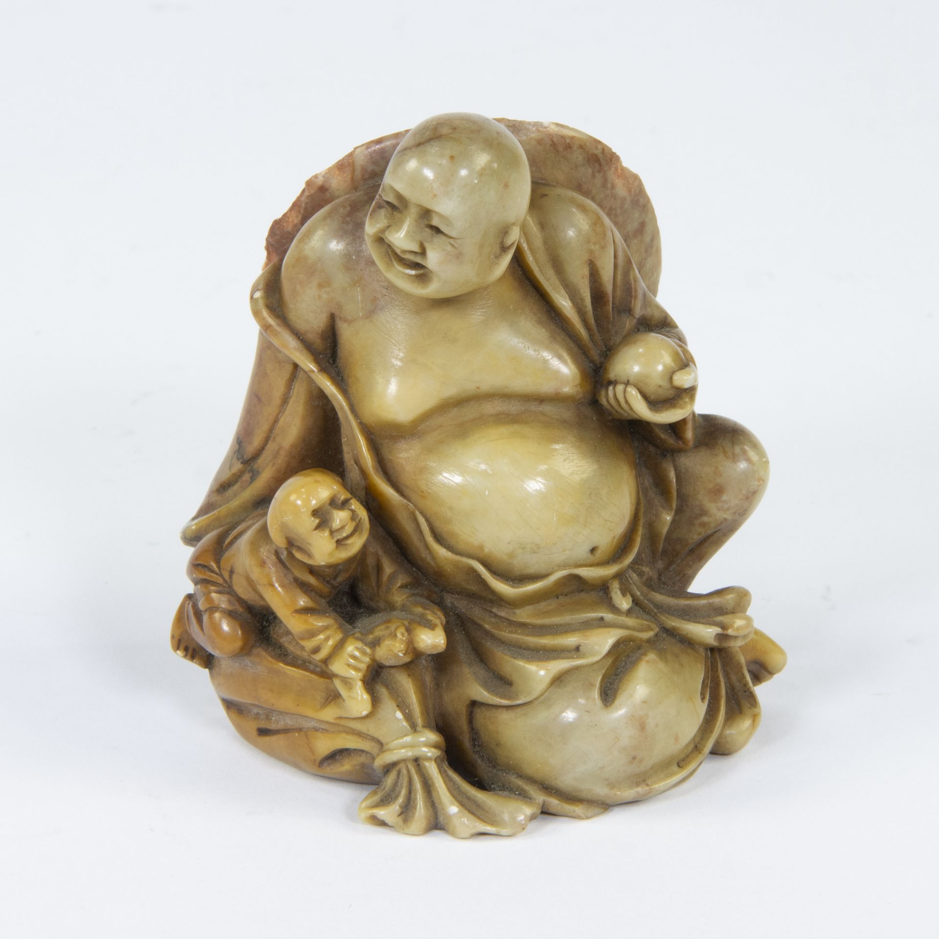 God of good luck and good fortune Hotei Buddha or laughing Buddha in soapstone