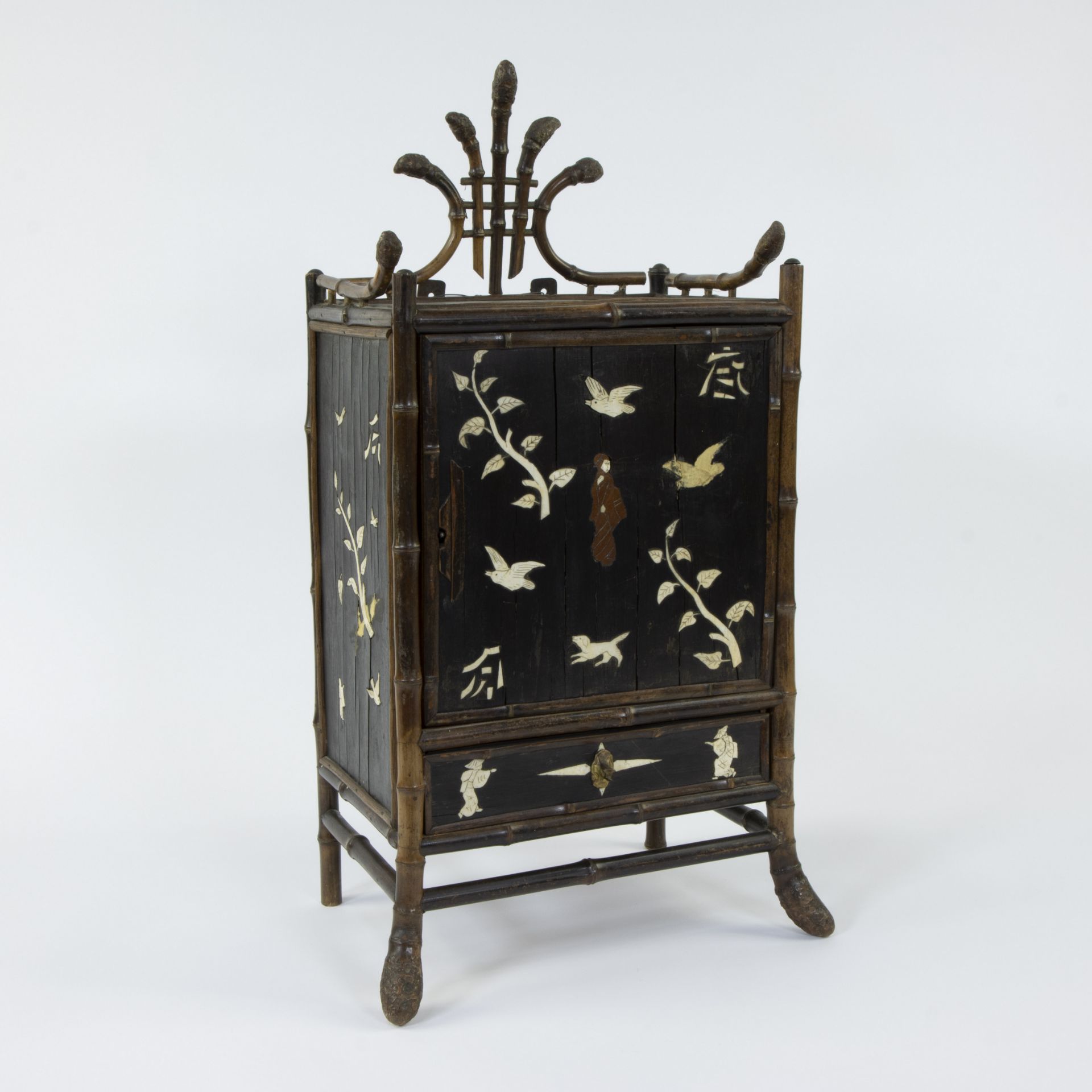 Asian bamboo cabinet with inlaid work of leaves, birds and figures in bone