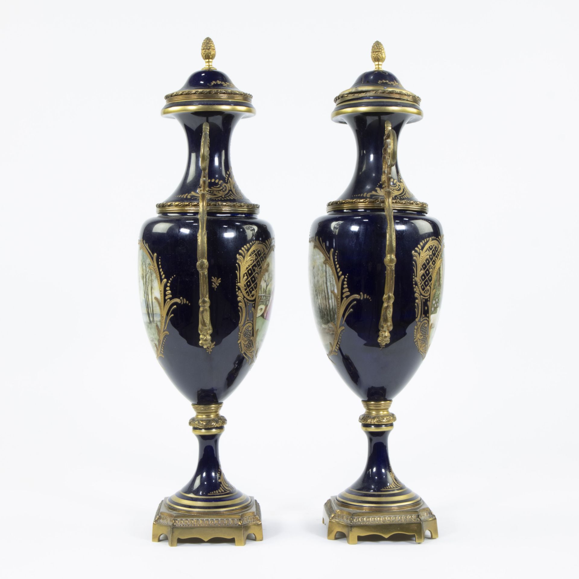 A pair of Sèvres ornamental vases of cobalt blue porcelain and gilt brass and decorated with multi-c - Image 5 of 7