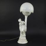 An alabaster and Carrara marble table lamp, decorated with the sculpture of a nude with towel, after