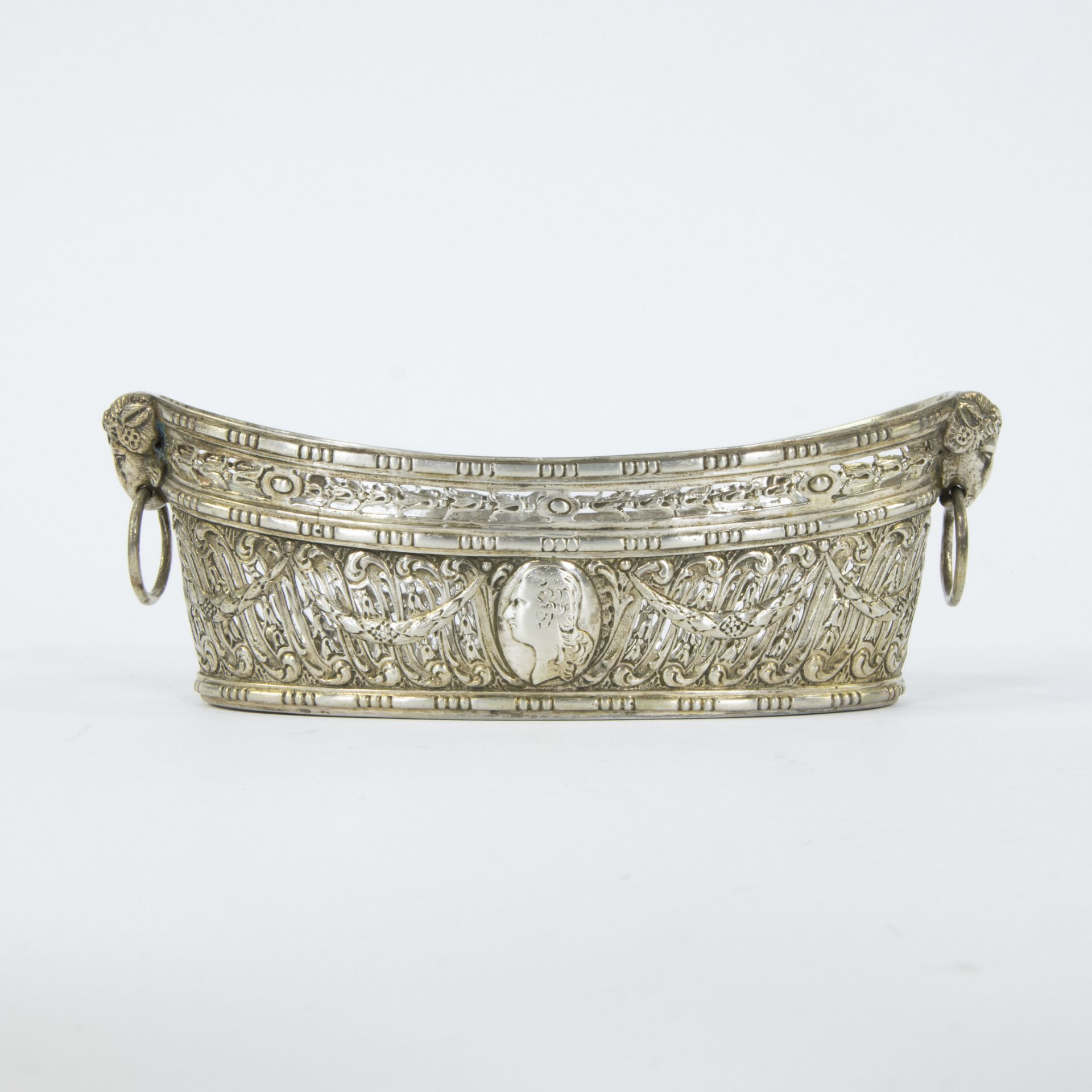 A French oval silver basket in Louis XVI style decorated with garlands, medallion and ram's heads