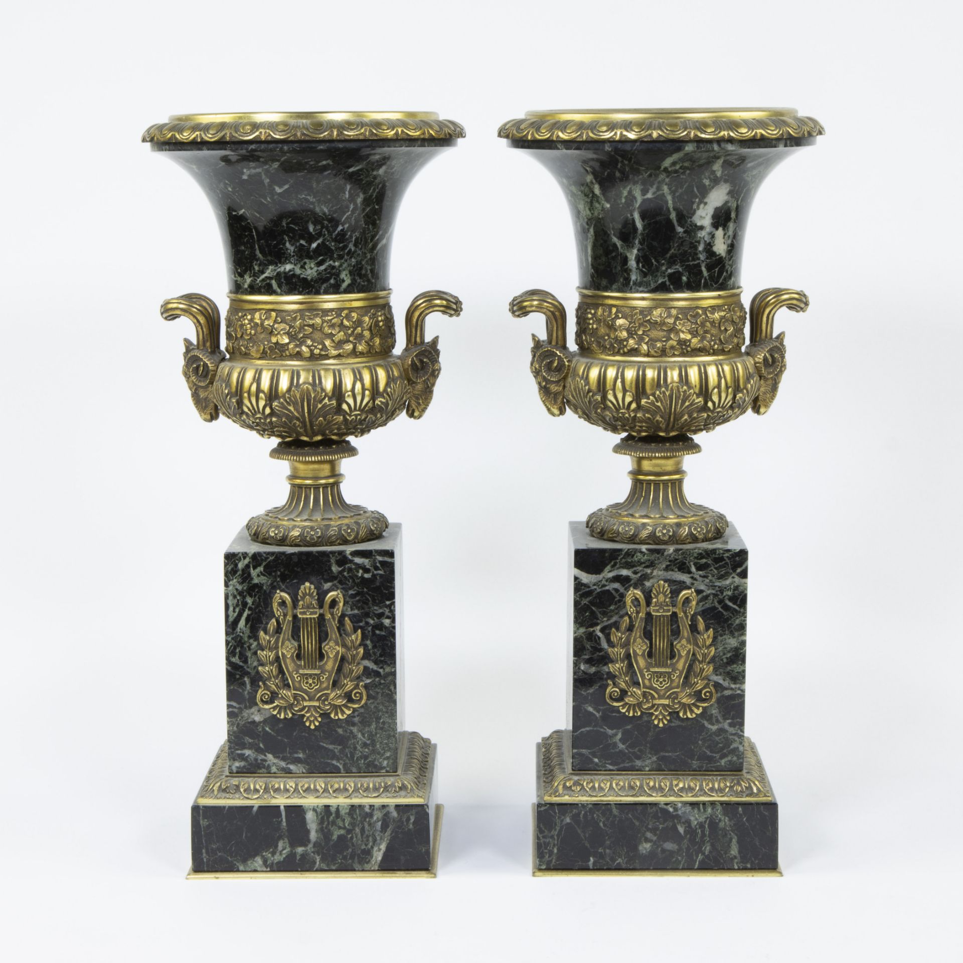 Pair of green-veined marble French Empire urns with gilt bronze fittings