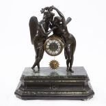 An impressive French patinated bronze mounted vert de mer marble Empire style mantel clock with Psyc